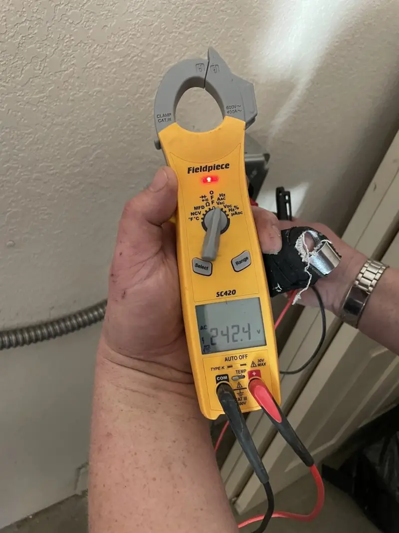 Voltage testing with clamp meter during Outlet Installation in South Abington